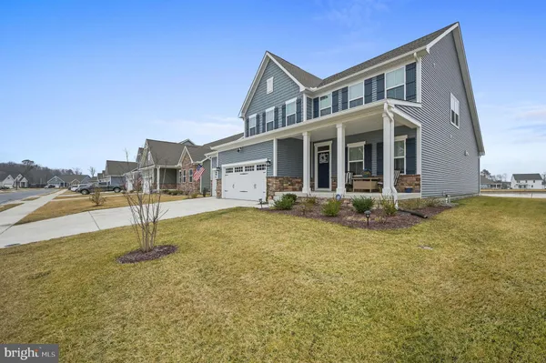 a house view with swimming pool and porch