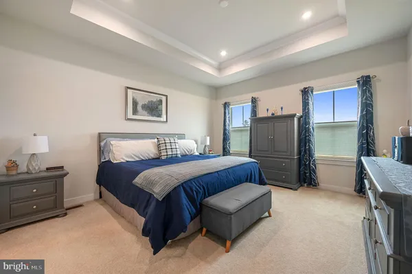 a bed room with a bed and a mirror