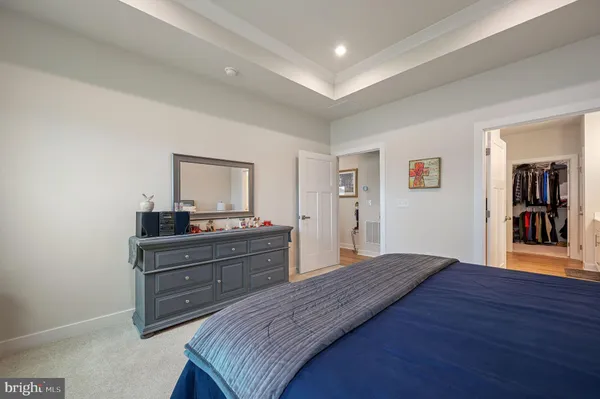 a spacious bedroom with a bed and window