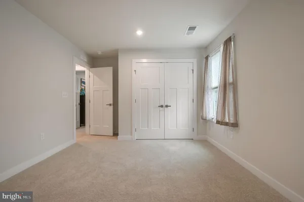 a bedroom with a bed and furniture