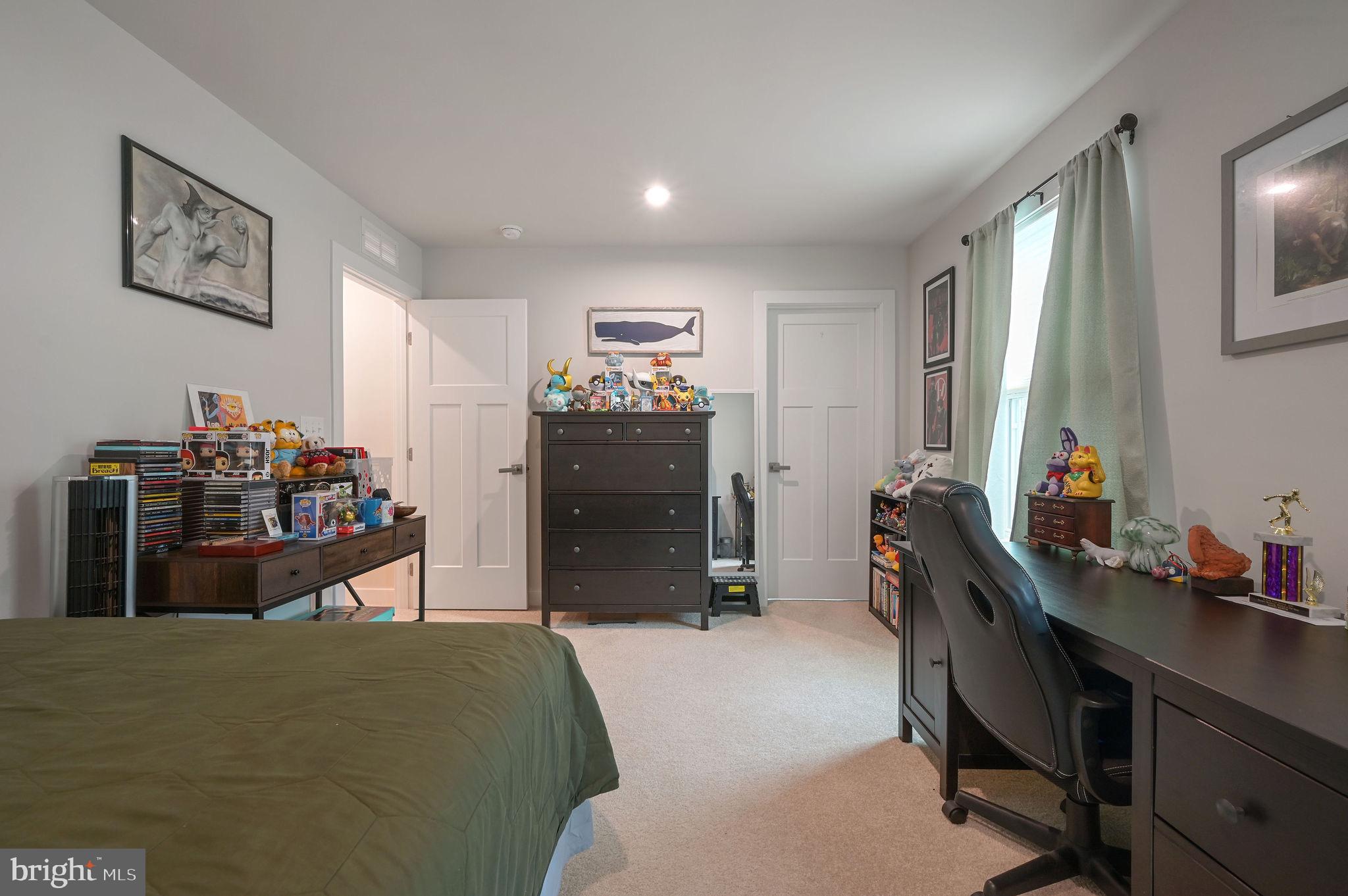 30366 Indigo Way Georgetown, DE 19947 - Photo 32 of 37 a bedroom with a bed and furniture