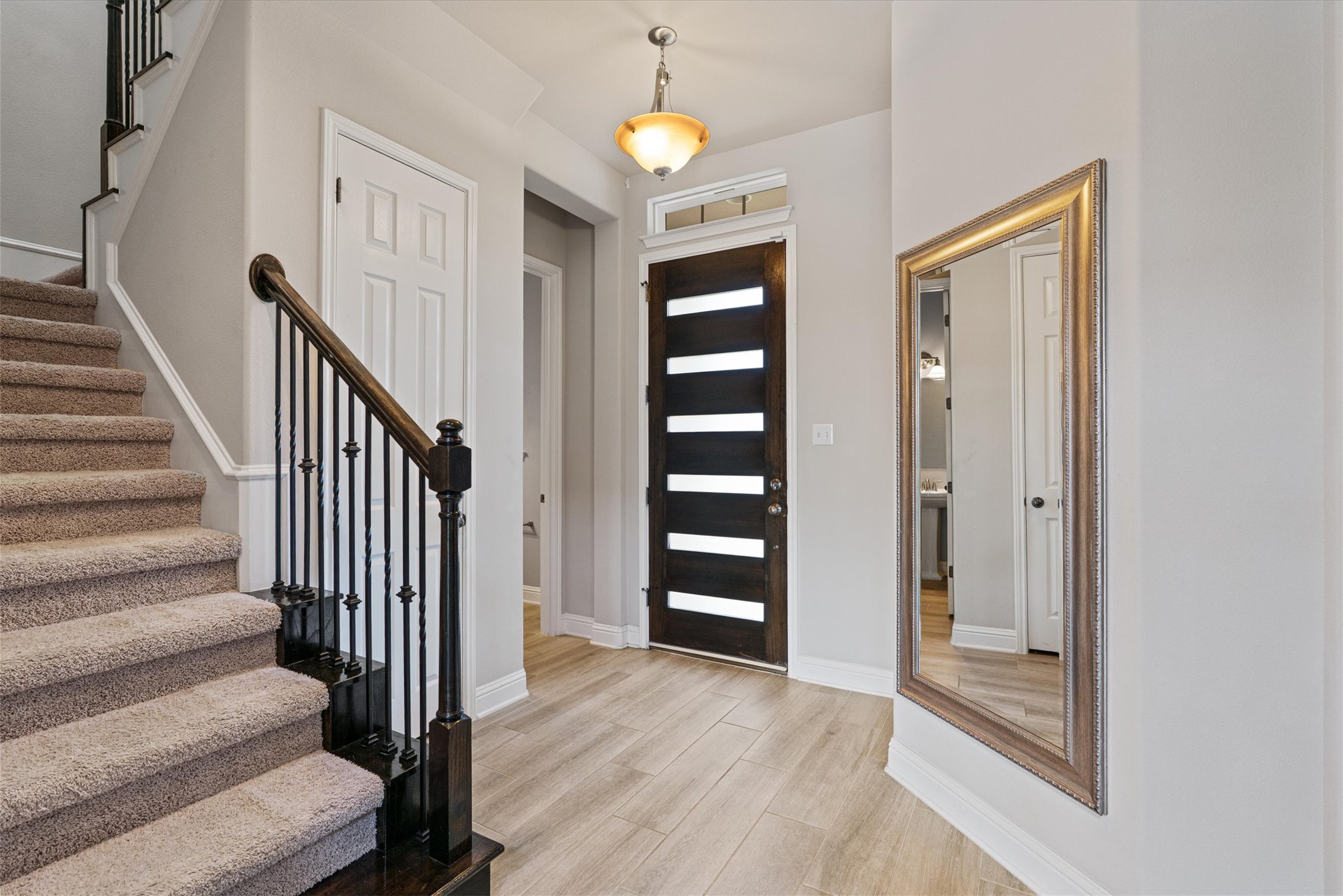 622 Cheyenne Lane Cedar Park, TX 78613 - Photo 4 of 40 Step inside to an entryway that feels immediately open and bright, leading you straight toward those incredible backyard views