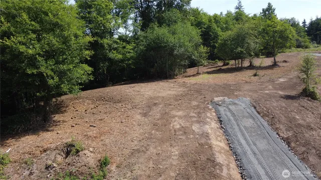 a view of a backyard of a house