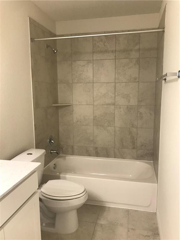 115 Iron Rail Road Dripping Springs, TX 78620 - Photo 12 of 16 Full bath with vanity, shower / bath combination, and light tile patterned floors