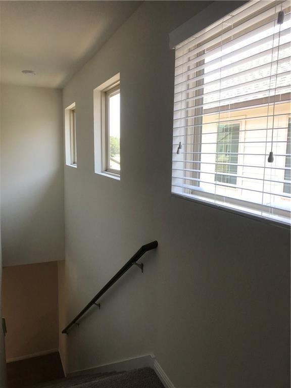115 Iron Rail Road Dripping Springs, TX 78620 - Photo 15 of 16 Staircase featuring baseboards