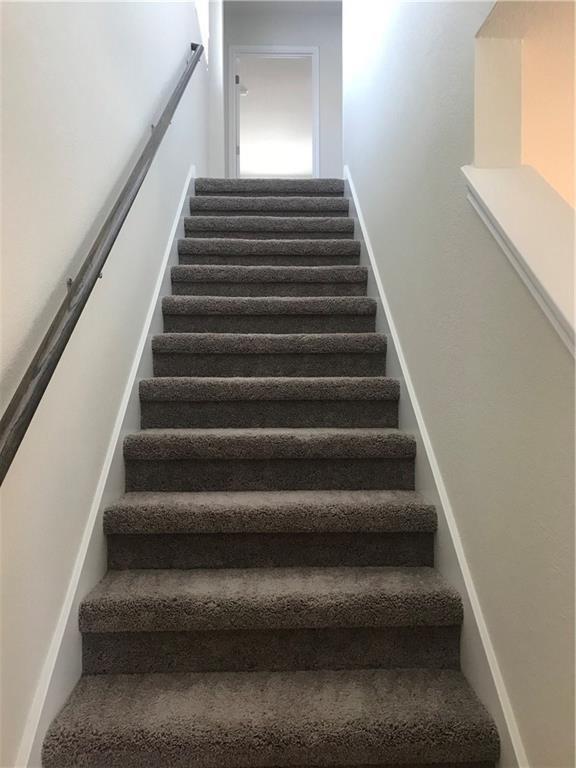115 Iron Rail Road Dripping Springs, TX 78620 - Photo 16 of 16 Stairs with baseboards
