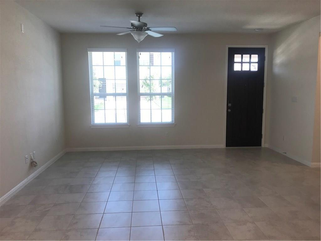 115 Iron Rail Road Dripping Springs, TX 78620 - Photo 4 of 16 Entryway featuring a ceiling fan and light tile patterned floors