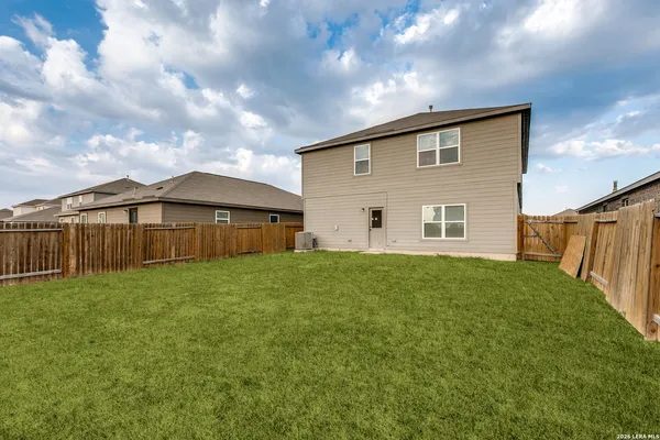 a view of a backyard of the house