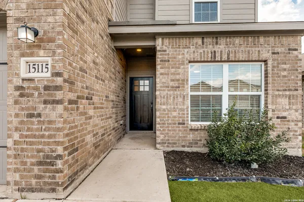 a view of front door of house with yard