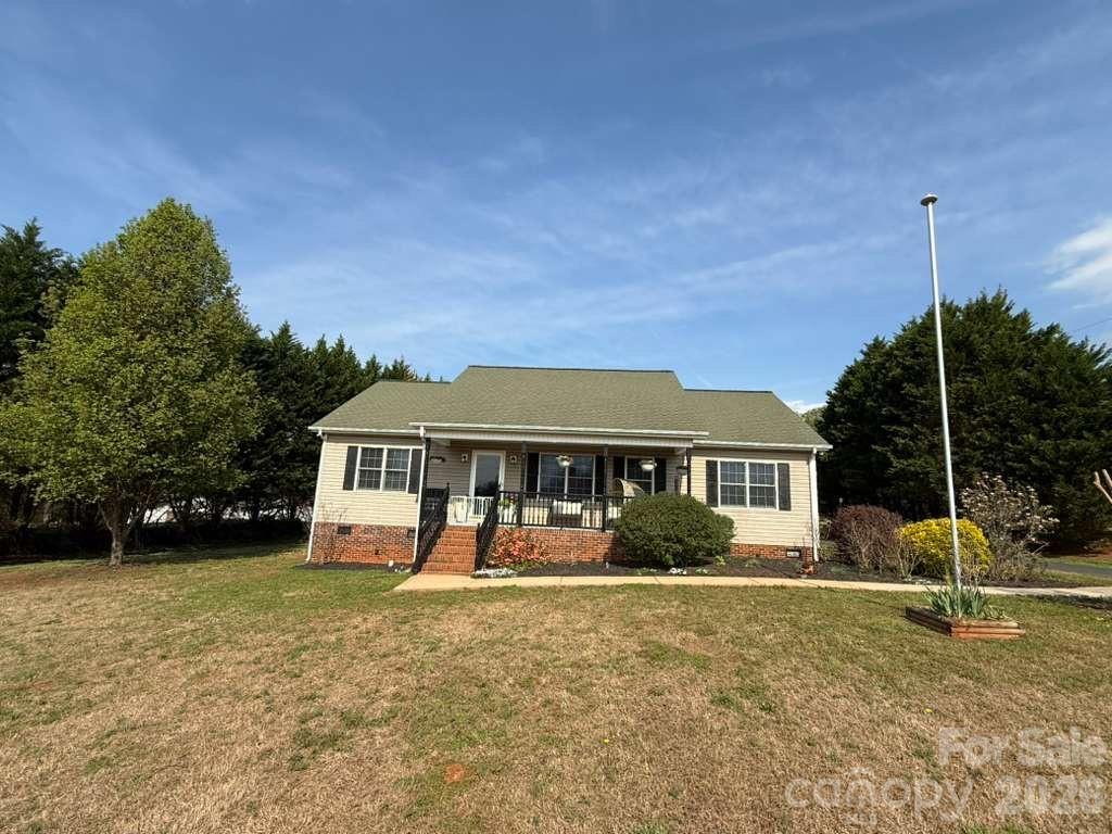 1882 George Brown Road Crouse, NC 28033 - Photo 1 of 48 a view of a house with a backyard and a tree