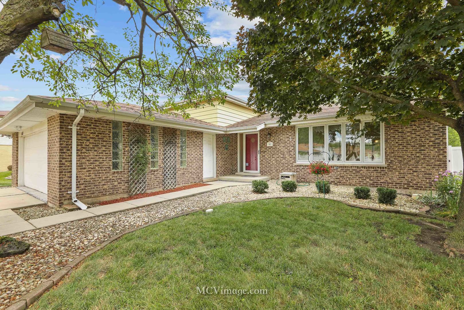 front view of a house with a yard