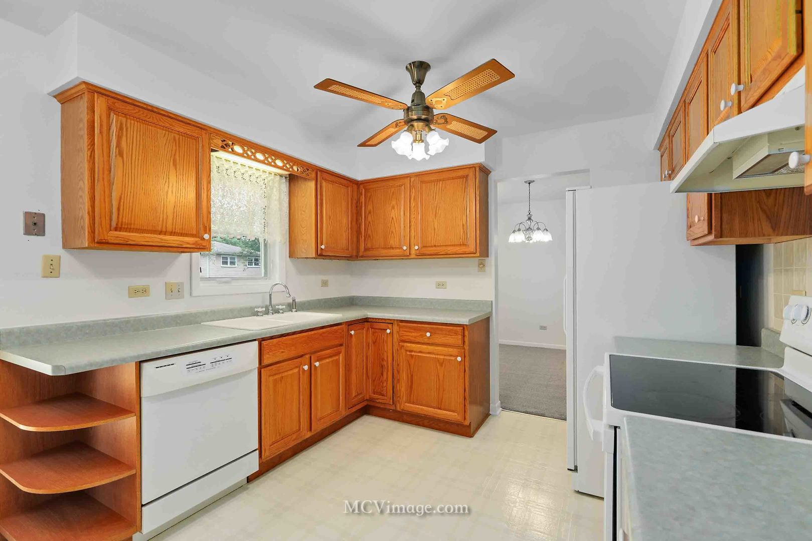 563 Quail Run Road Matteson, IL 60443 - Photo 9 of 25 a kitchen with stainless steel appliances granite countertop a sink dishwasher stove and cabinets