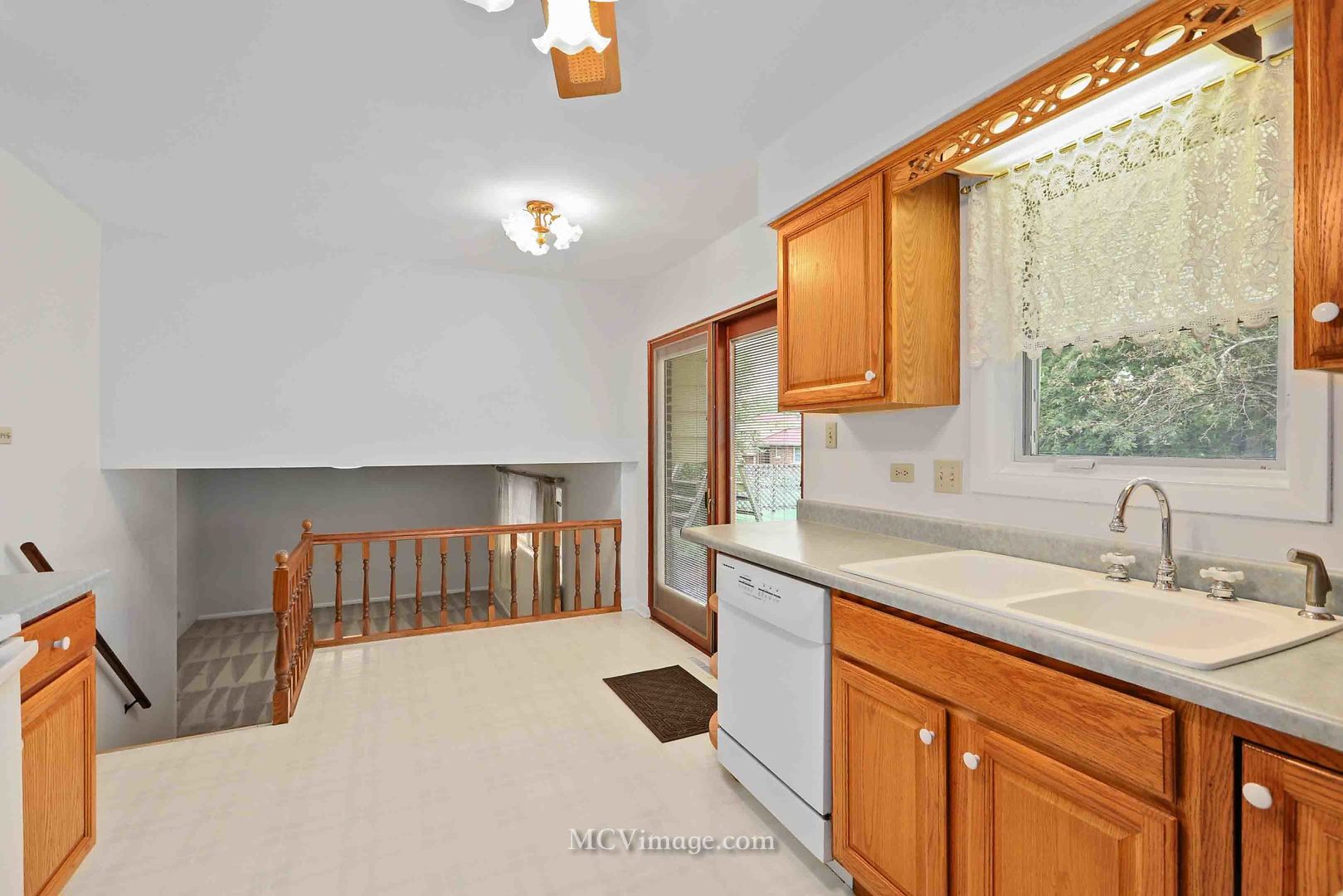 563 Quail Run Road Matteson, IL 60443 - Photo 10 of 25 a kitchen with a sink cabinets and a window