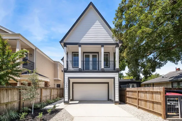 a front view of a house with garage