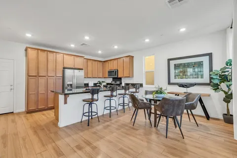 a view of a dining room with furniture window and wooden floor