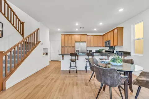 a view of a dining room with furniture window and wooden floor