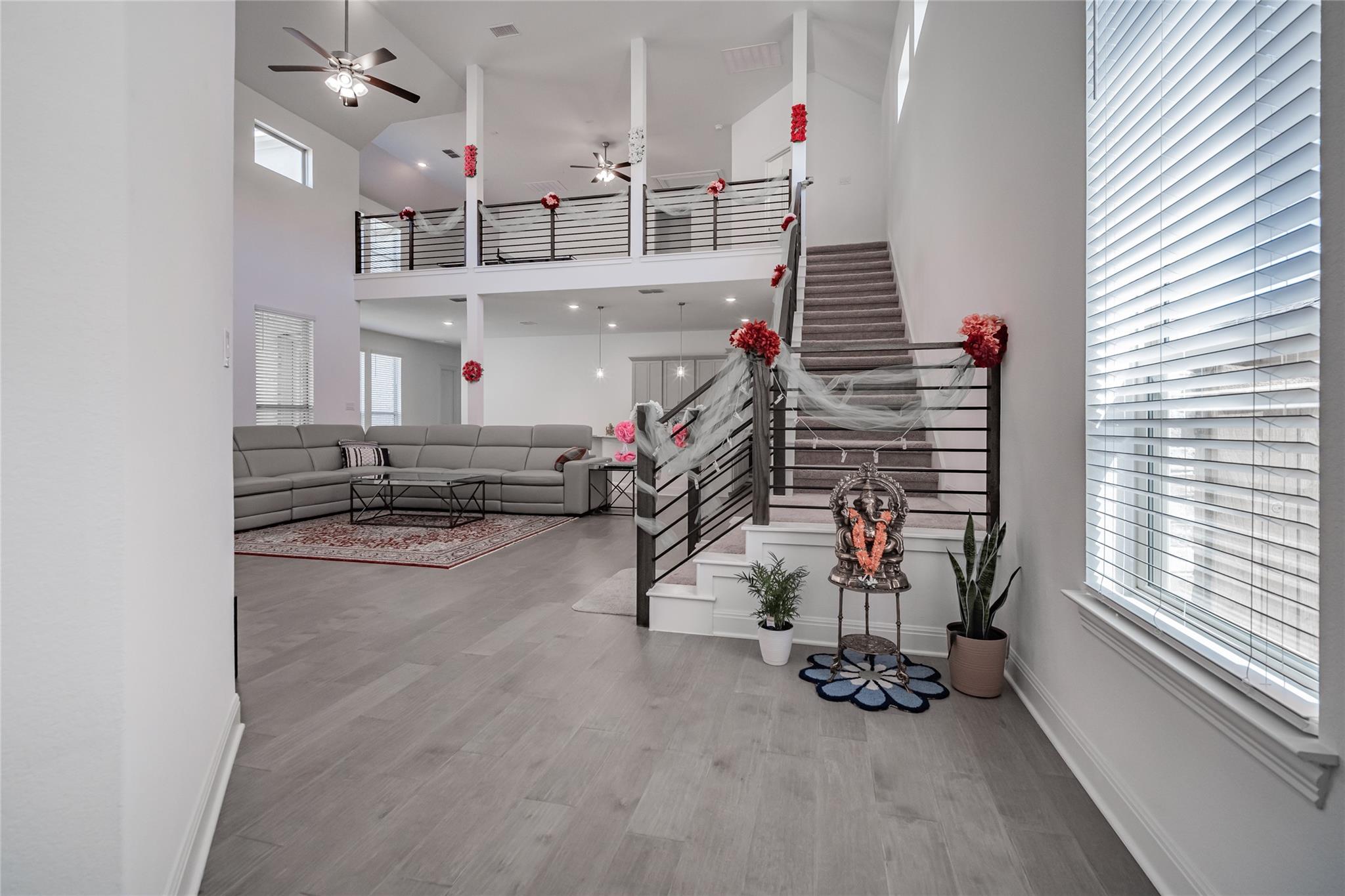 3049 Sage Ranch Drive Leander, TX 78641 - Photo 21 of 23 Two-story volume ceiling and open-concept design highlight this generously proportioned living space.