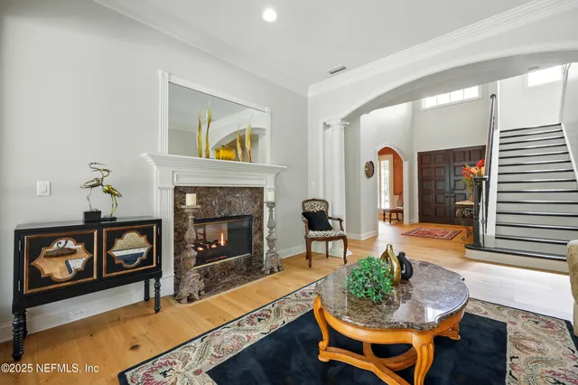 a living room with furniture and a fireplace