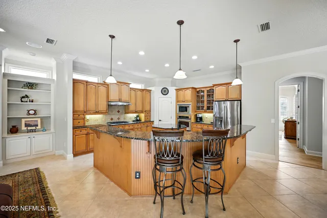 a living room with furniture a rug and a window
