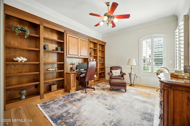 a spacious bedroom with a bed a dresser and a large mirror