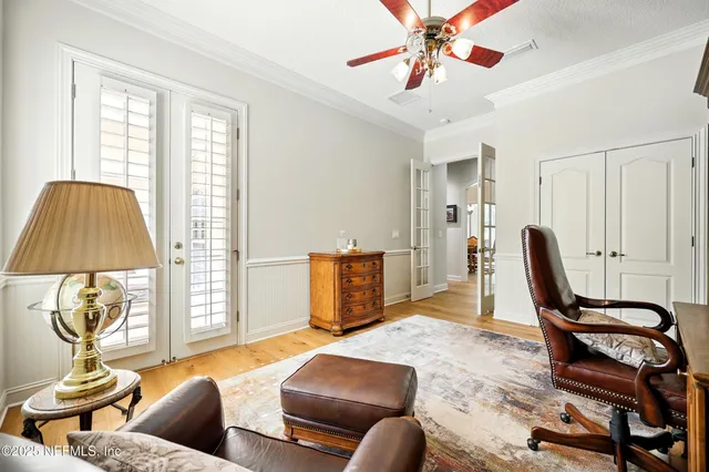 a view of a patio with a table and chairs under an umbrella