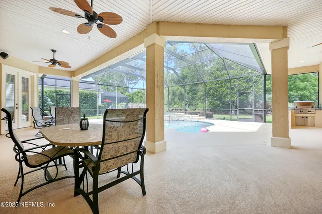 a view of a swimming pool with a patio