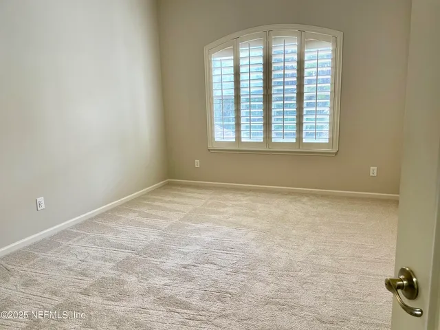 an aerial view of a pool patio chairs and fire pit