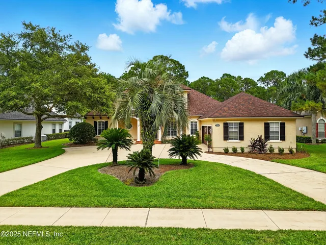 an aerial view of a house yard swimming pool and outdoor seating