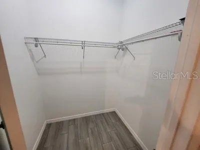 a white toilet sitting next to a bathroom sink and a shower