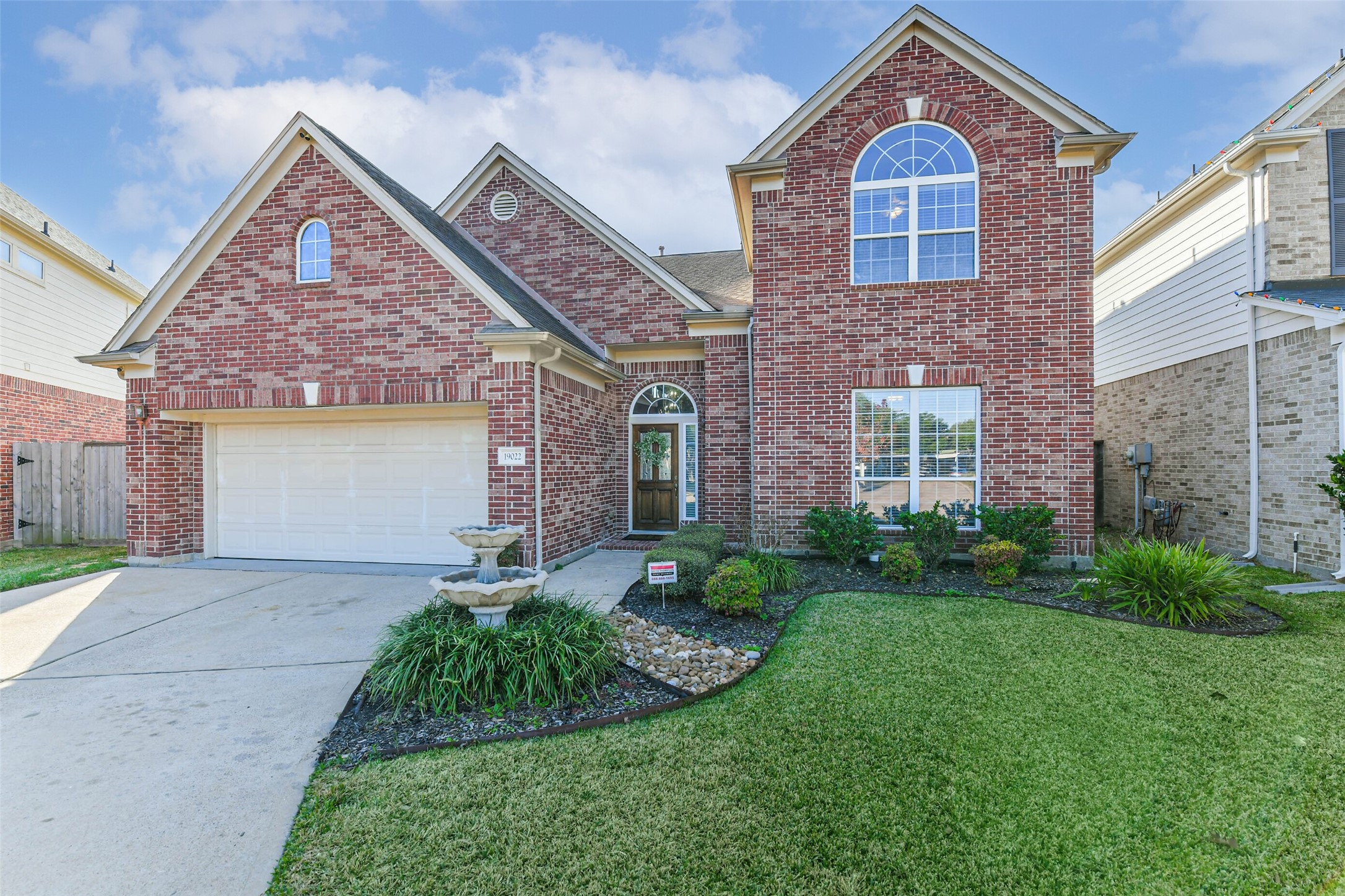 19022 Greenleaf Ridge Court Cypress, TX 77429 - Photo 6 of 47 a front view of a house with garden