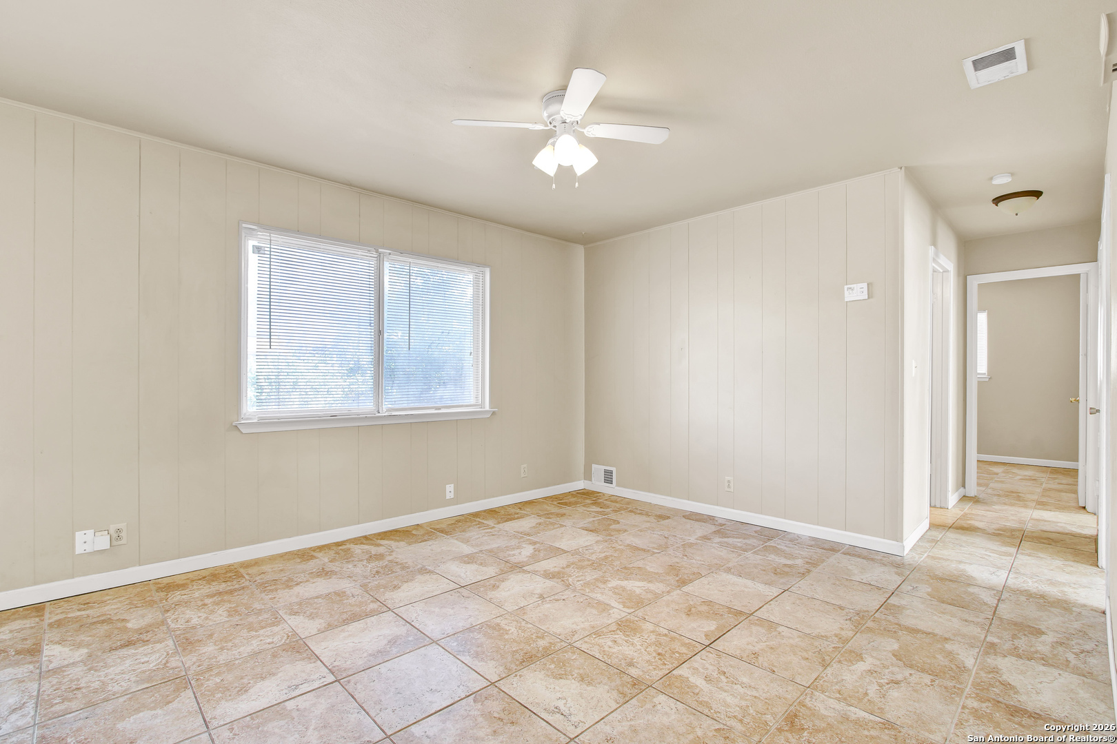 6711 Spring Hollow Street San Antonio, TX 78249 - Photo 5 of 23 a view of an empty room with a window