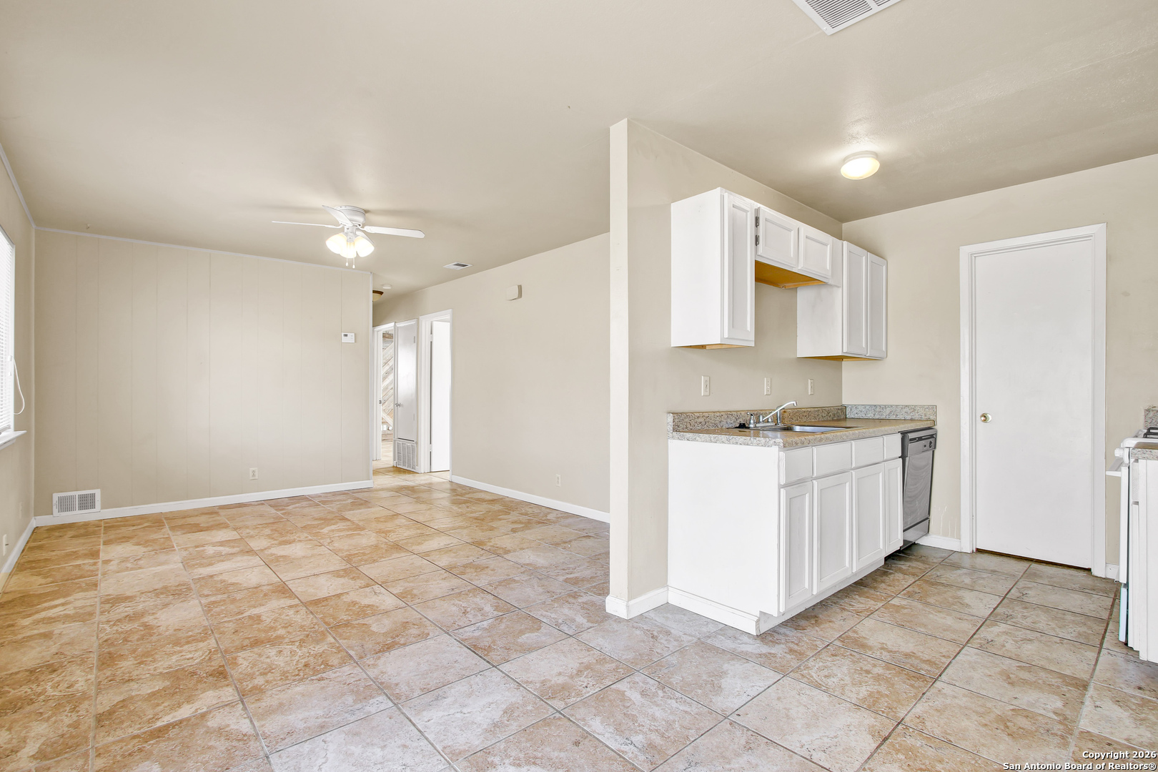 6711 Spring Hollow Street San Antonio, TX 78249 - Photo 8 of 23 a kitchen with a stove a sink and a refrigerator