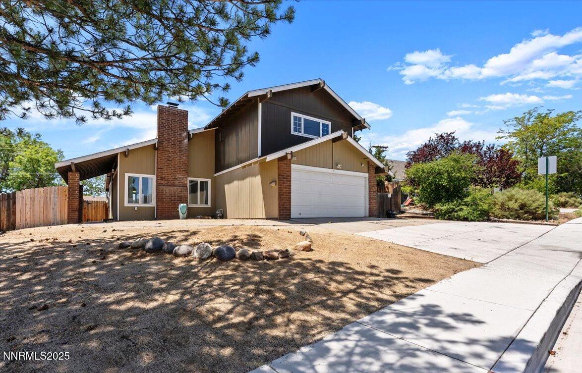 2060 Kings Row Reno, NV 89503 - Photo 1 of 37 a front view of a house with a yard