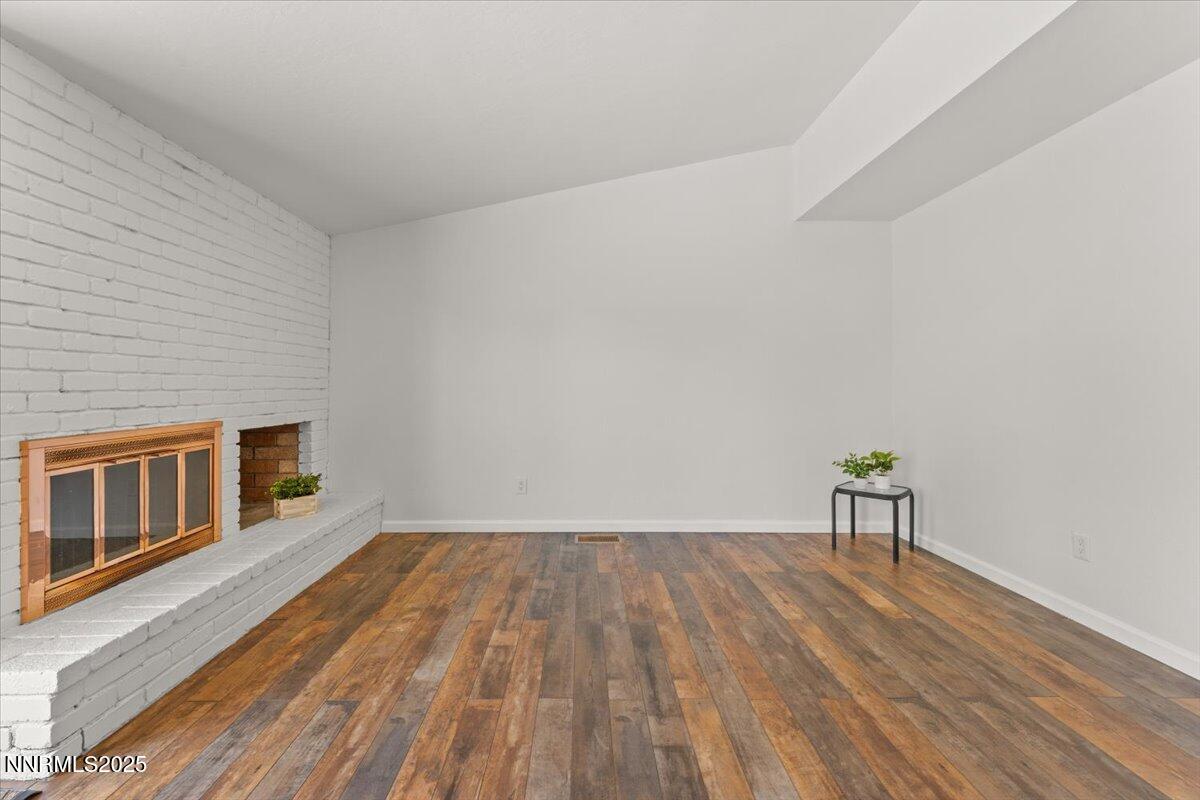 2060 Kings Row Reno, NV 89503 - Photo 12 of 37 a view of empty room with wooden floor