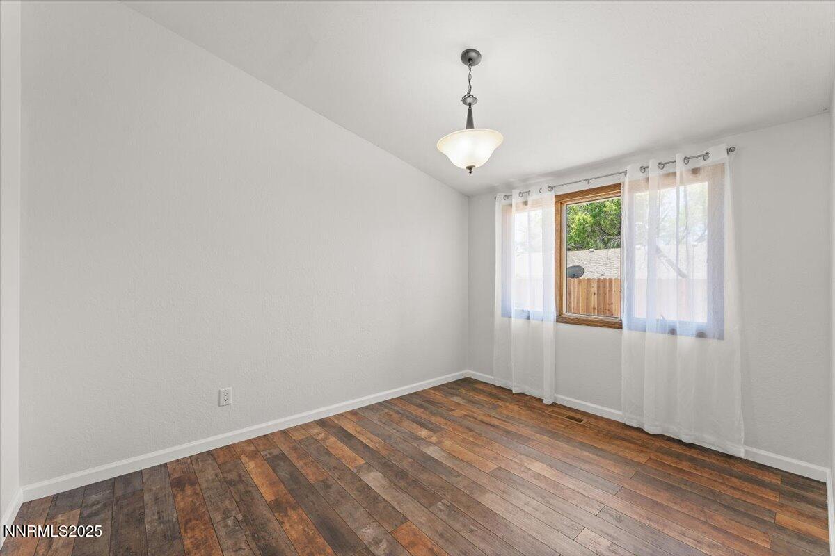 2060 Kings Row Reno, NV 89503 - Photo 14 of 37 a view of empty room with wooden floor and fan