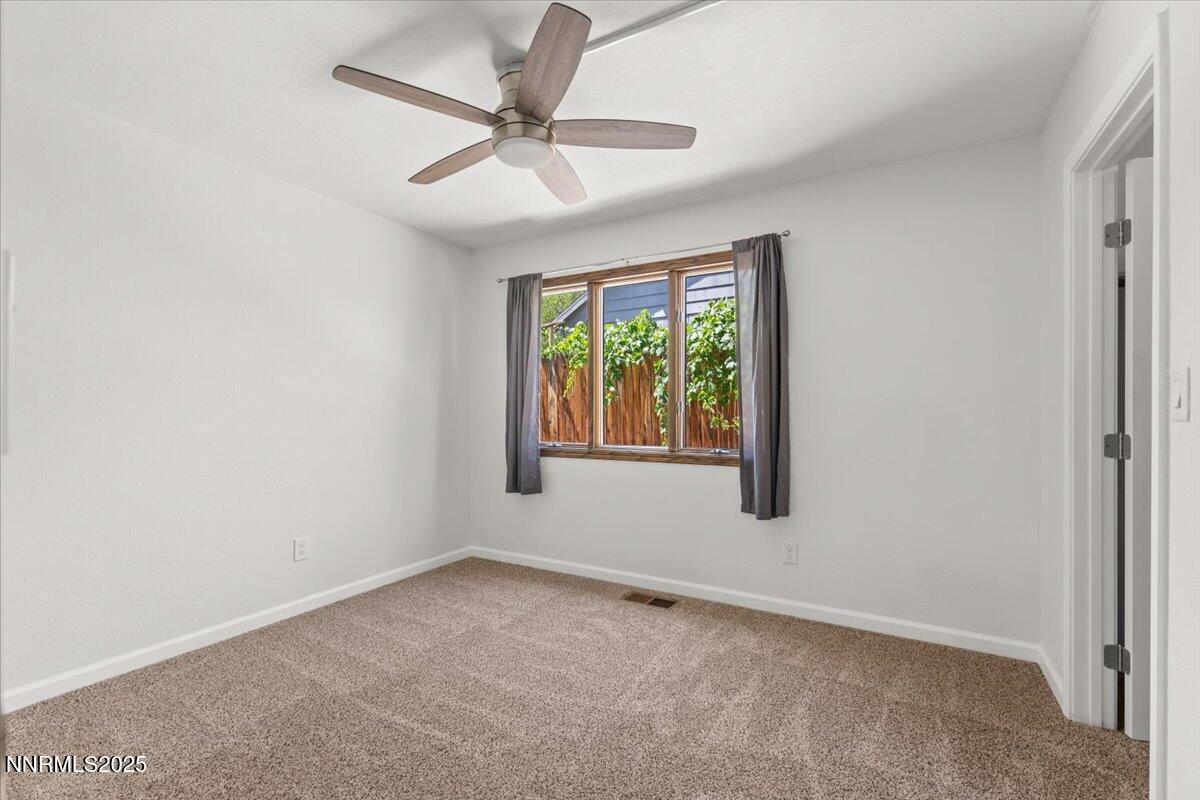 2060 Kings Row Reno, NV 89503 - Photo 17 of 37 an empty room with a window and a fan