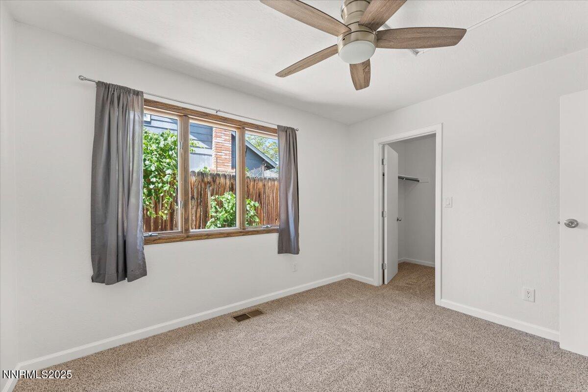 2060 Kings Row Reno, NV 89503 - Photo 18 of 37 an empty room with windows and fan