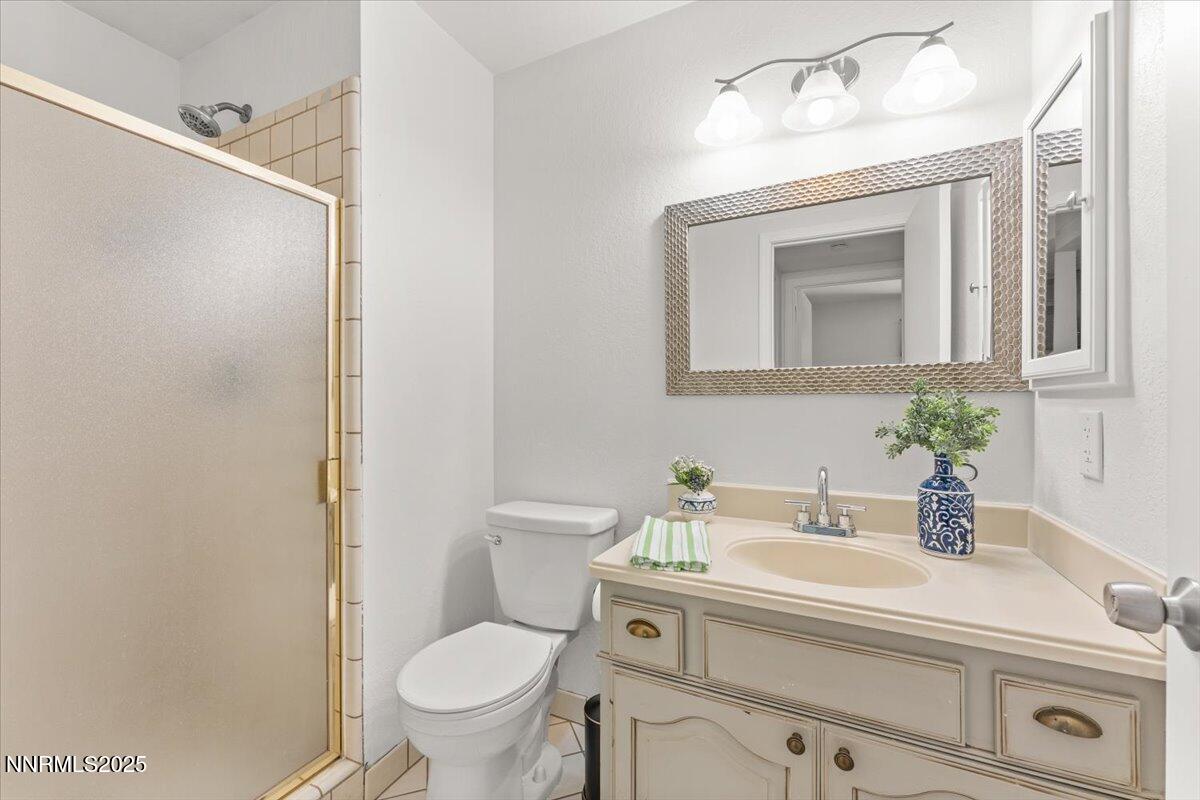 2060 Kings Row Reno, NV 89503 - Photo 19 of 37 a bathroom with a sink toilet and shower