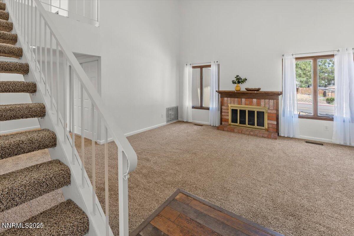 2060 Kings Row Reno, NV 89503 - Photo 3 of 37 a view of a livingroom with wooden floor and fireplace