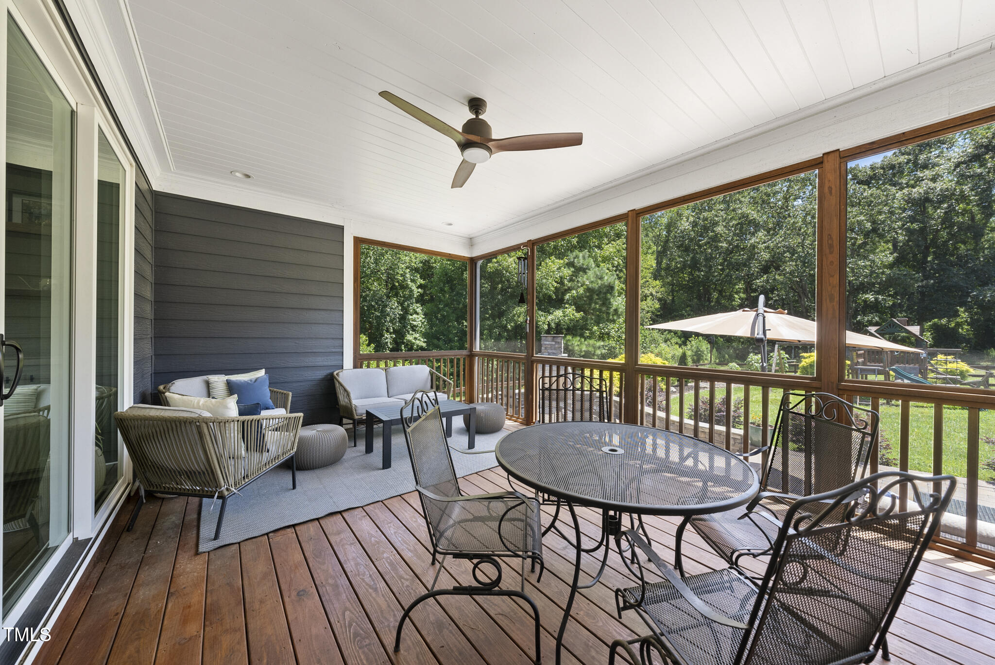2416 Eddie Howard Road Willow Spring, NC 27592 - Photo 11 of 64 a balcony with furniture and wooden floor