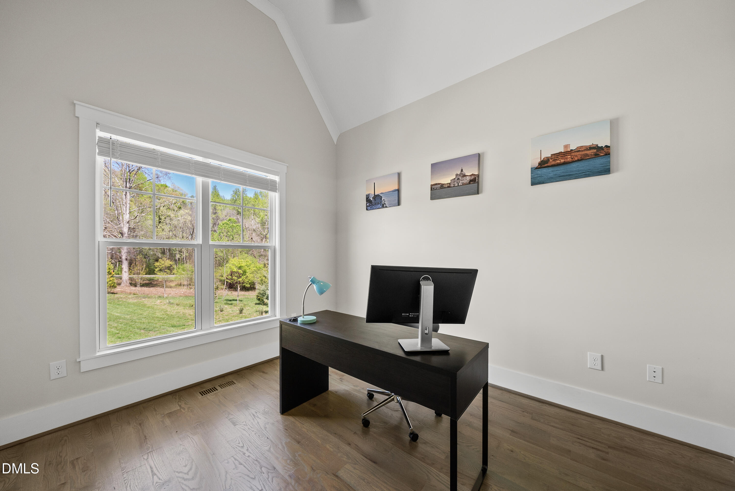 2416 Eddie Howard Road Willow Spring, NC 27592 - Photo 23 of 64 a view of a workspace with furniture and a window