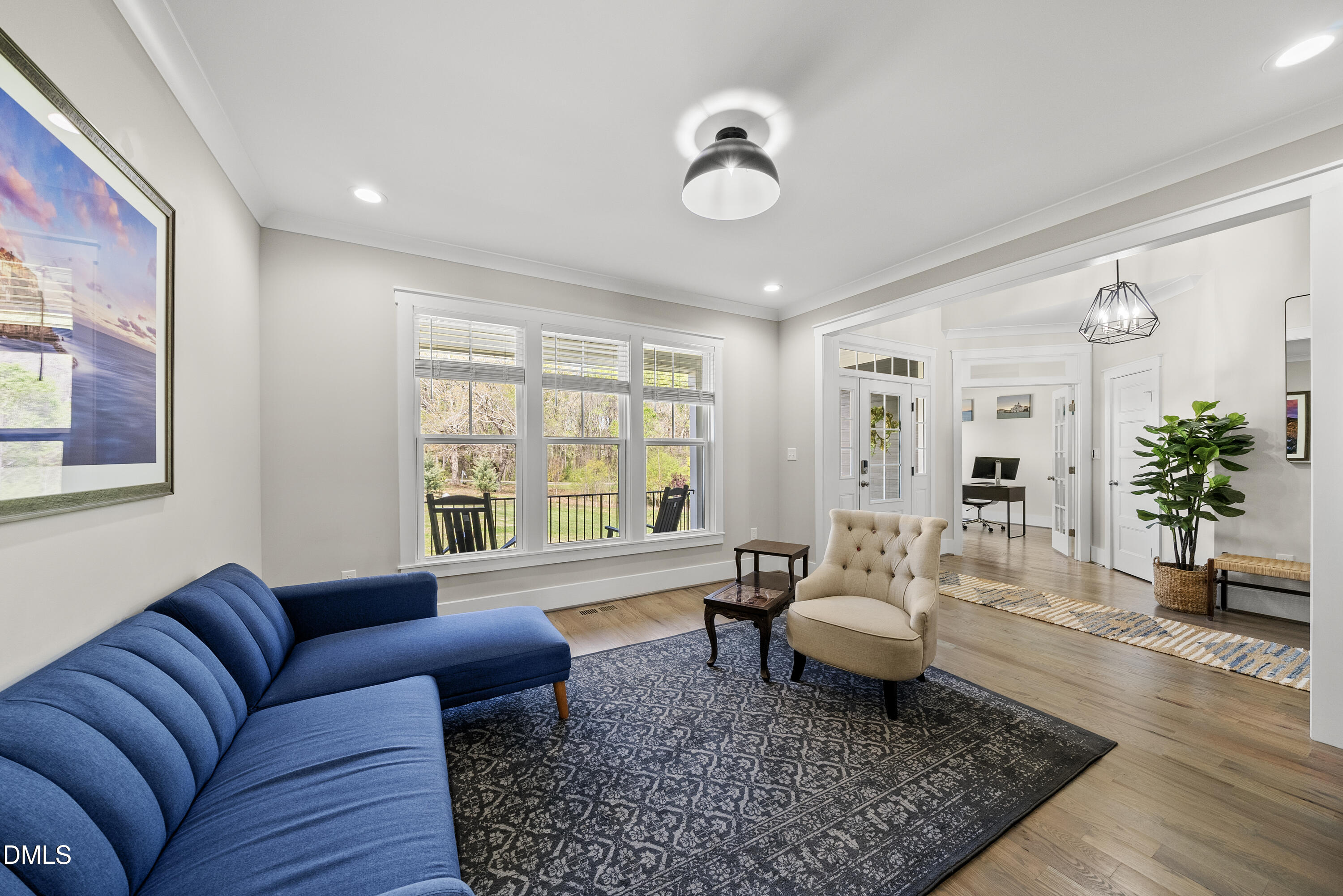 2416 Eddie Howard Road Willow Spring, NC 27592 - Photo 24 of 64 a living room with furniture and wooden floor