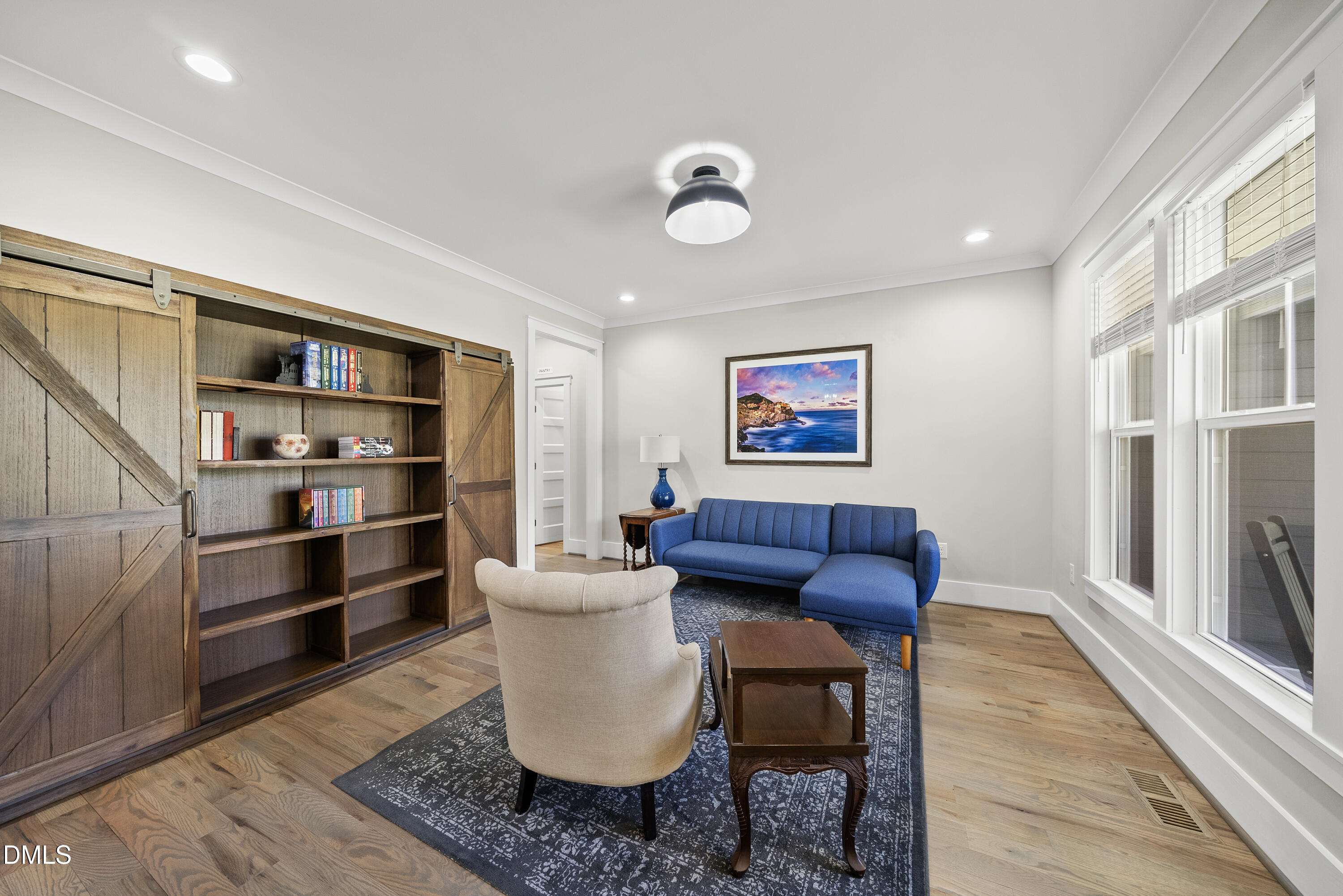 2416 Eddie Howard Road Willow Spring, NC 27592 - Photo 25 of 64 a living room with furniture a rug and a window
