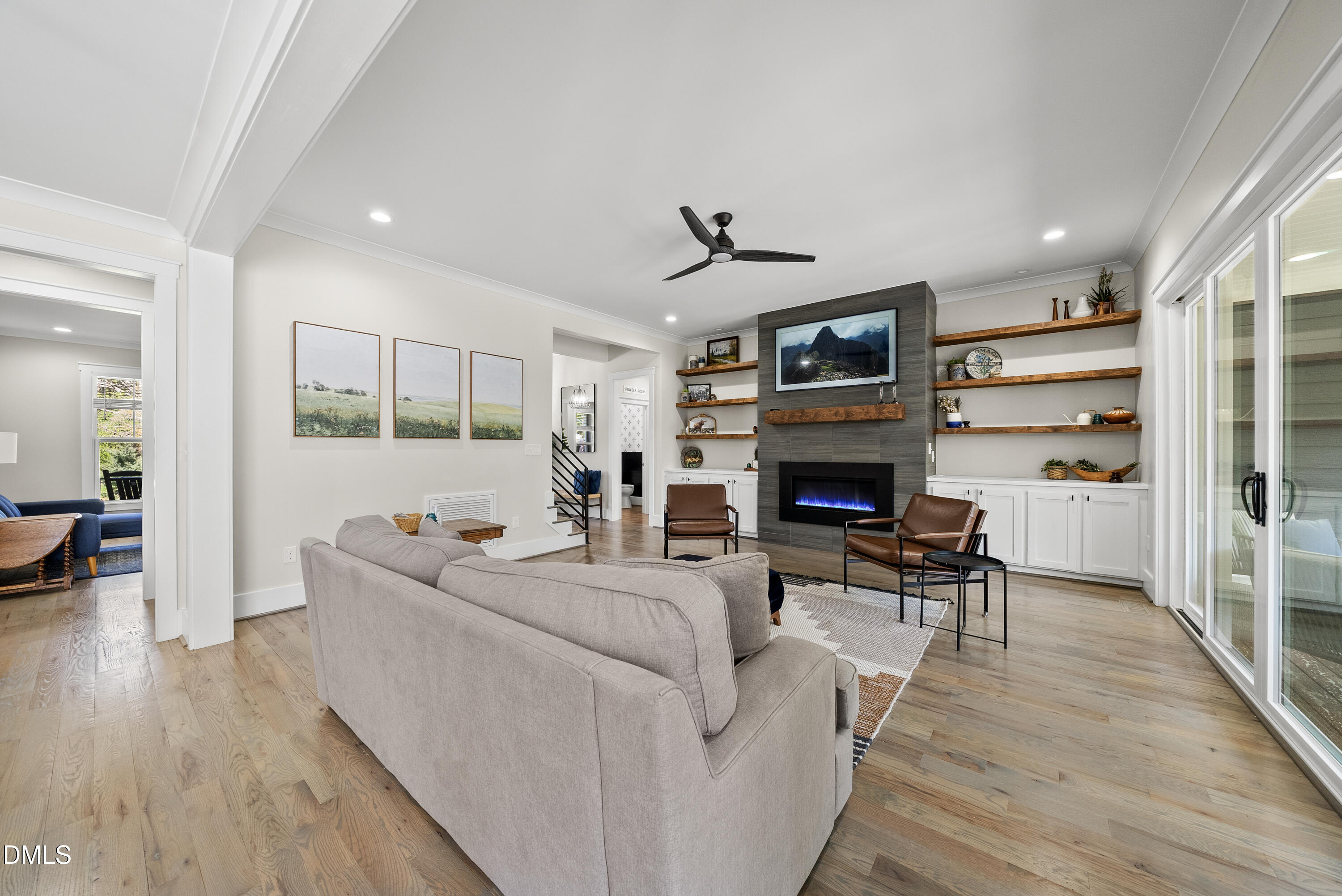 2416 Eddie Howard Road Willow Spring, NC 27592 - Photo 27 of 64 a living room with furniture fireplace and flat screen tv