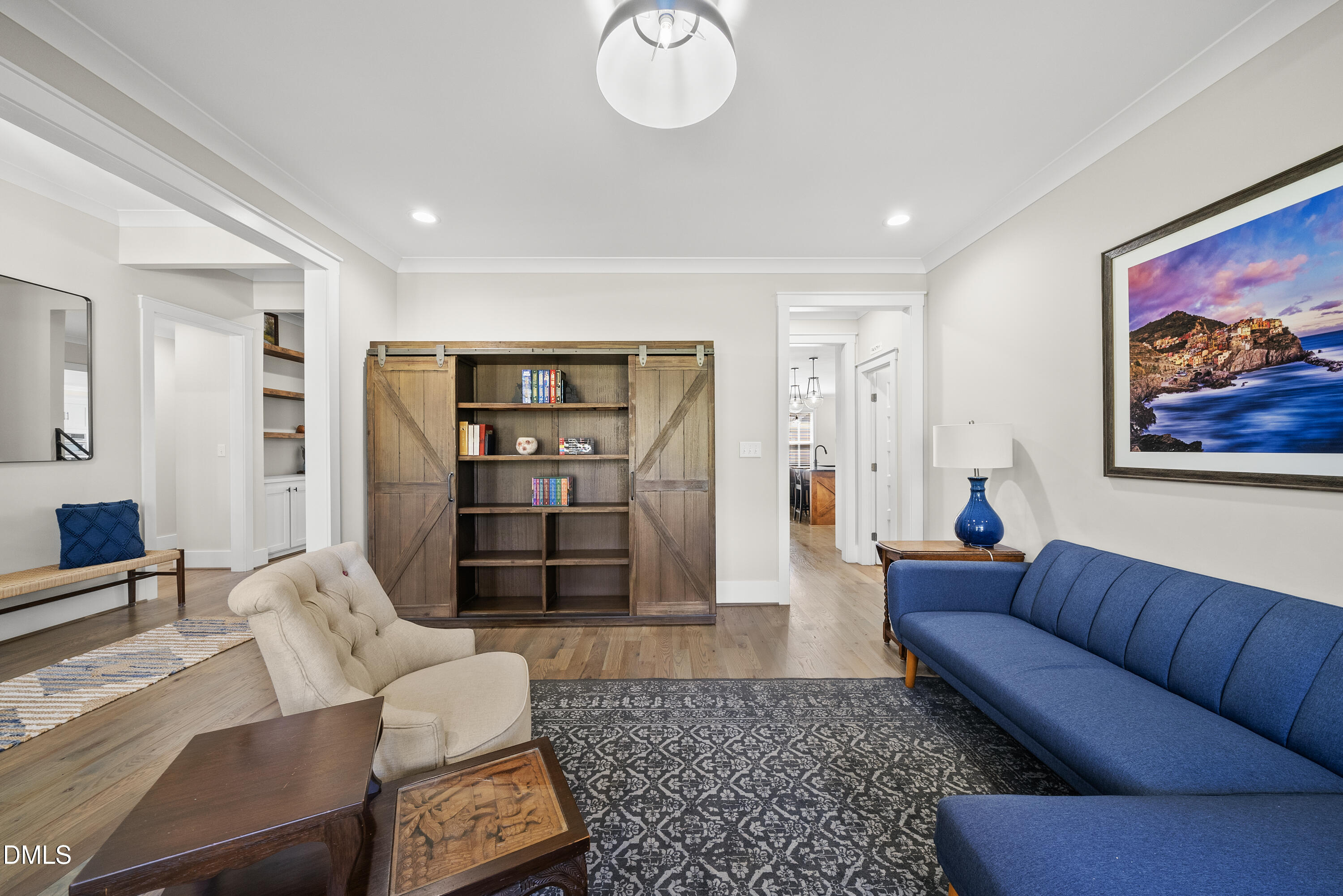 2416 Eddie Howard Road Willow Spring, NC 27592 - Photo 28 of 64 a living room with furniture and a rug