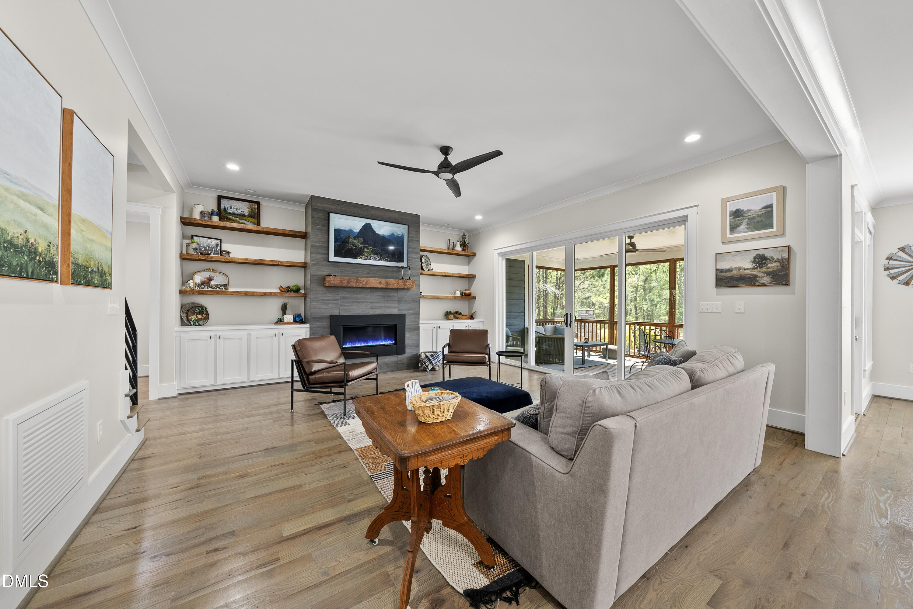 2416 Eddie Howard Road Willow Spring, NC 27592 - Photo 29 of 64 a living room with furniture or fireplace and a wooden floor