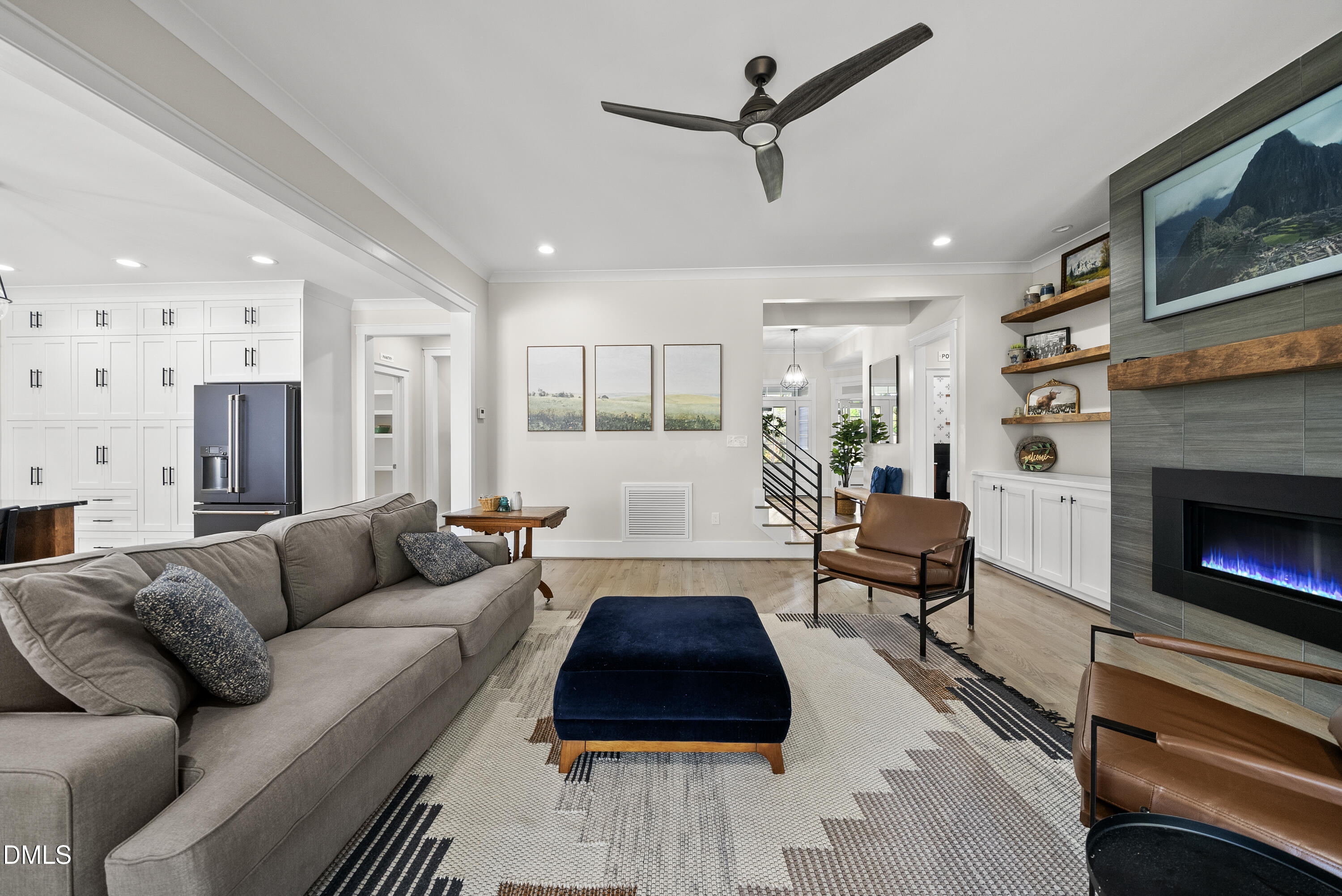 2416 Eddie Howard Road Willow Spring, NC 27592 - Photo 30 of 64 a living room with furniture and a fireplace