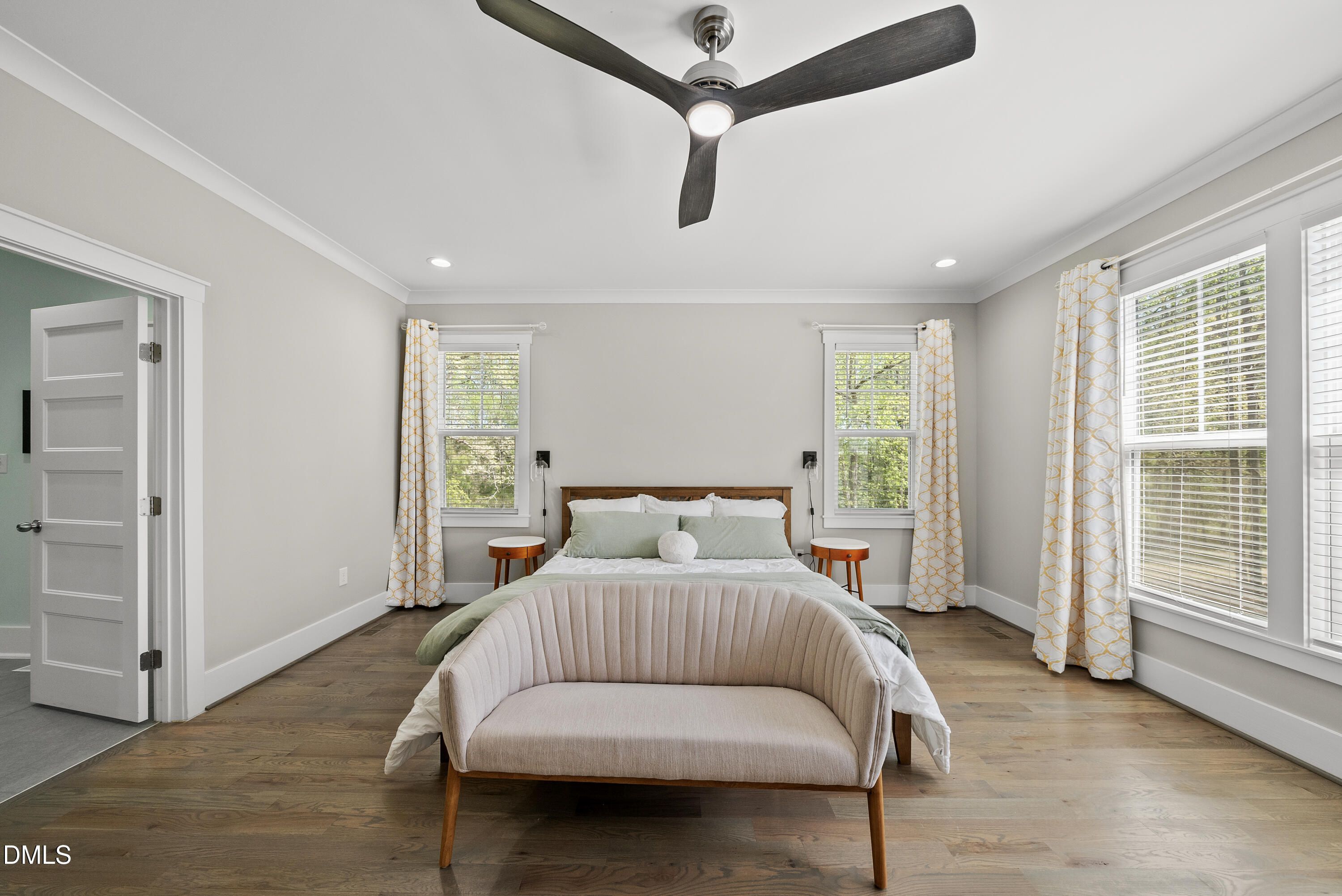 2416 Eddie Howard Road Willow Spring, NC 27592 - Photo 33 of 64 a bedroom with a bed and wooden floor