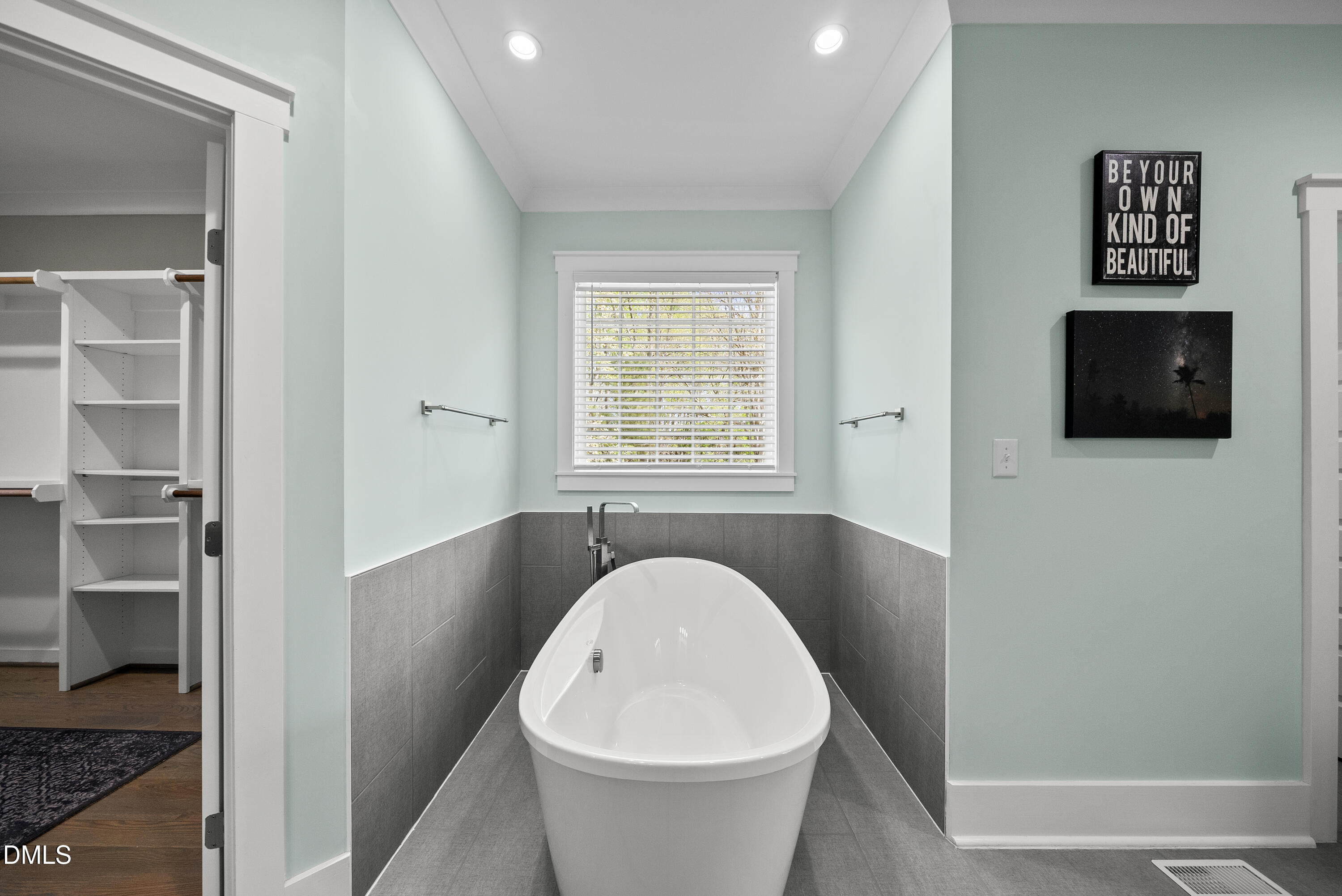 2416 Eddie Howard Road Willow Spring, NC 27592 - Photo 37 of 64 a very nice looking room with a white bed and a flat screen tv