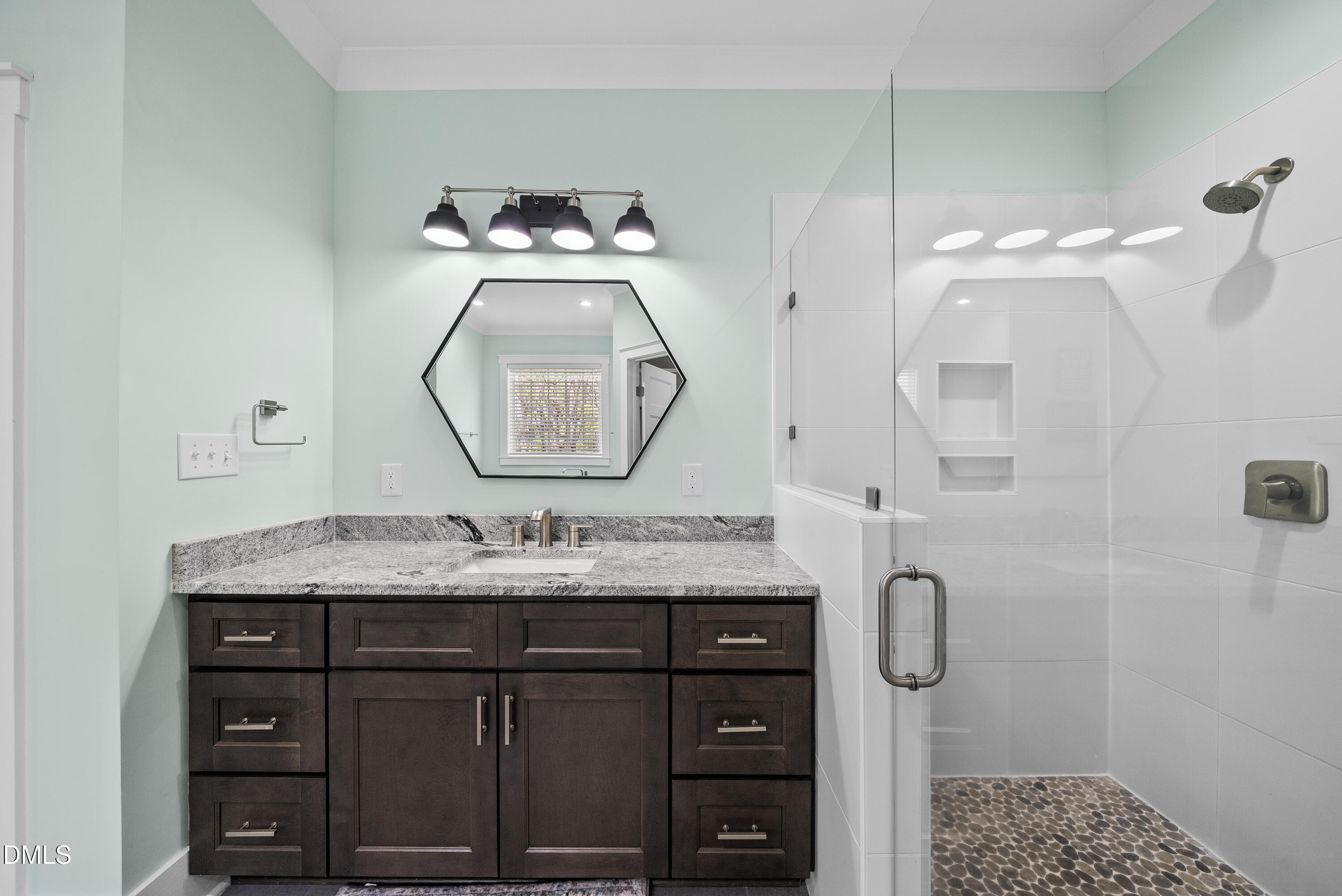 2416 Eddie Howard Road Willow Spring, NC 27592 - Photo 38 of 64 a bathroom with a sink vanity granite and a mirror